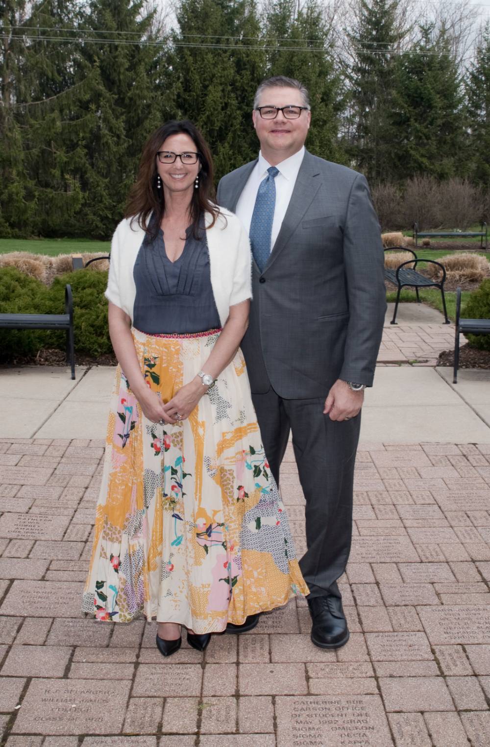 Award winner poses with wife (outdoors)